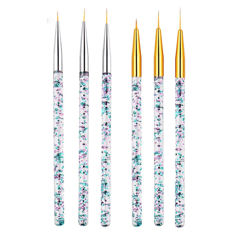 A set of precision nail art brushes with gold ferrules and clear handles featuring floral accents.