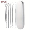 A set of five stainless steel dental cleaning tools including a mirror and various picks