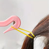 A pink hair styling tool is shown next to a strand of brown hair, demonstrating the kit's components.