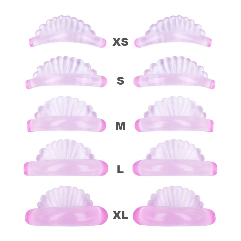 A set of pink silicone eyelash curlers in various sizes from XS to XL.