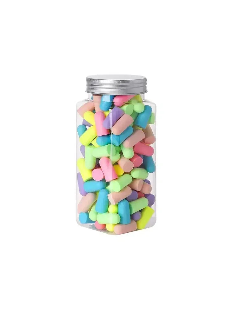 A glass jar filled with colorful memory foam earplugs for noise reduction