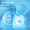 A clear blue dental floss kit with a dispenser and floss is shown against a light blue background.
