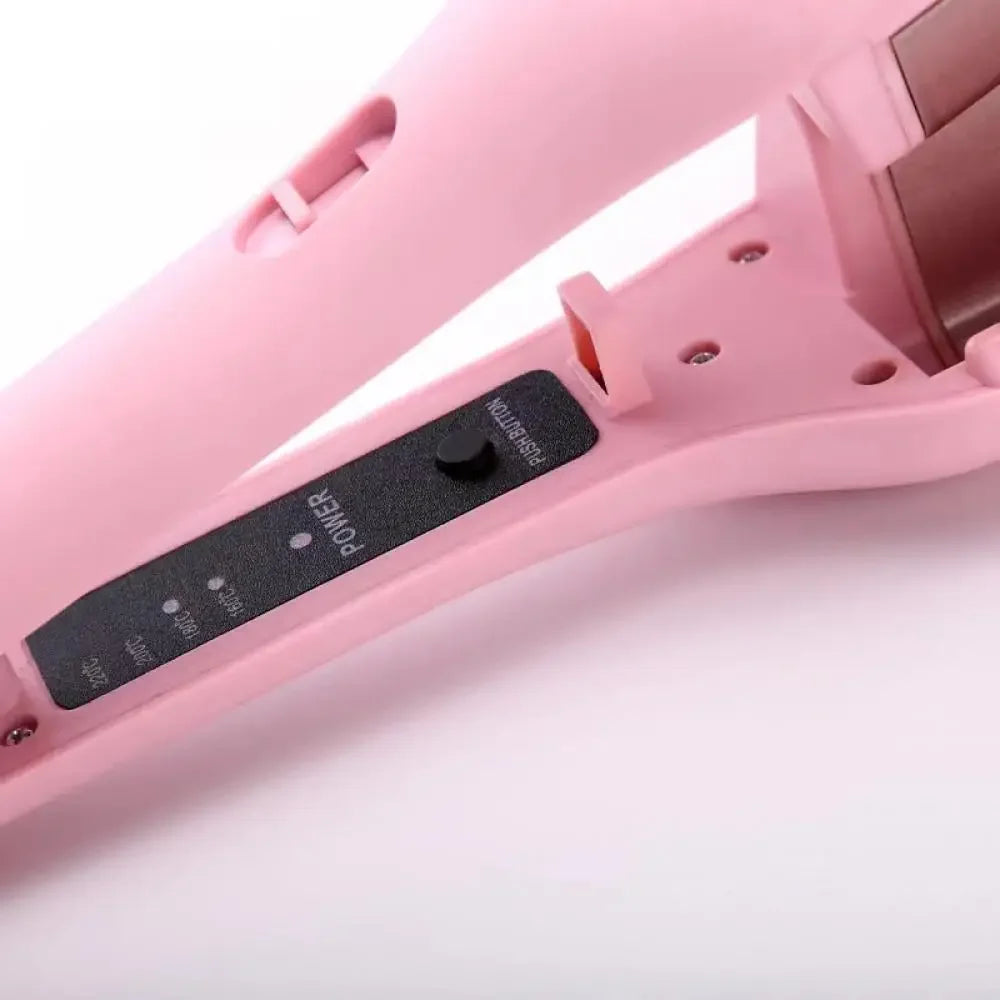 A pink professional ceramic hair curling iron with a black push button is shown in a close-up view.