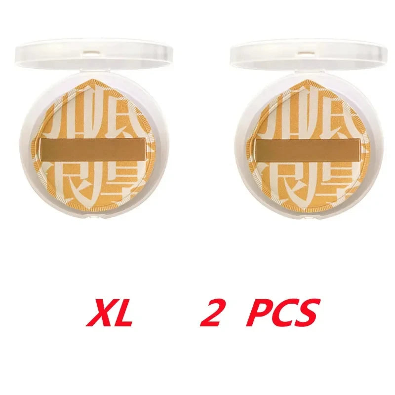 Pair of dual-sided makeup sponge puffs in gold packaging for flawless application