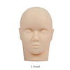 A realistic silicone mannequin head used for eyelash extension practice, light beige color.
