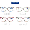 A selection of high definition magnifying reading glasses in blue, green, purple, and lavender frames.