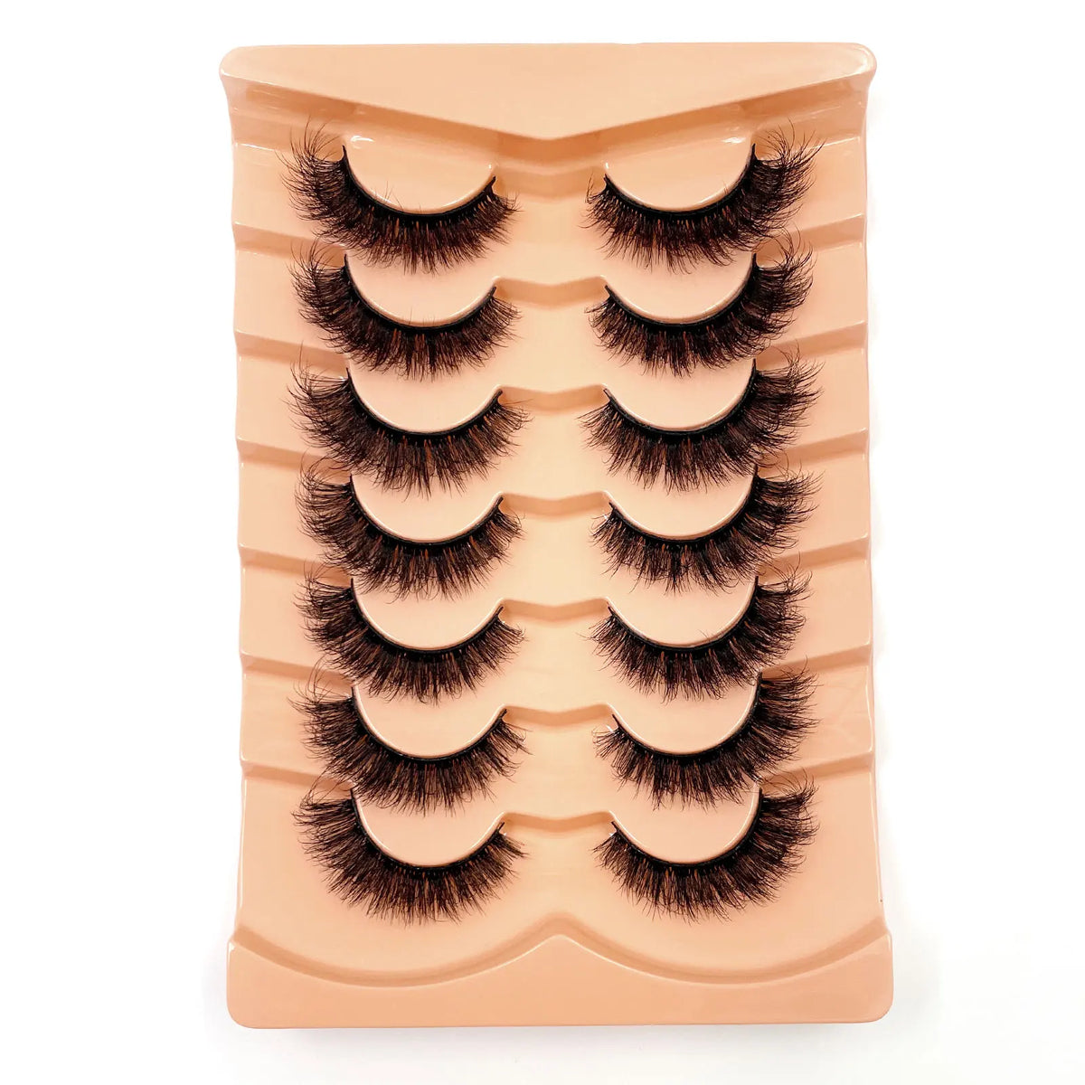 Un plateau de faux cils de mink 3D dramatiques de couleur nude rose.