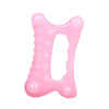 A pink resin facial gua sha massage tool shaped like the letter O