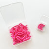 A clear plastic container holds a 30 count of bright pink reusable silicone eyelash curler pads.