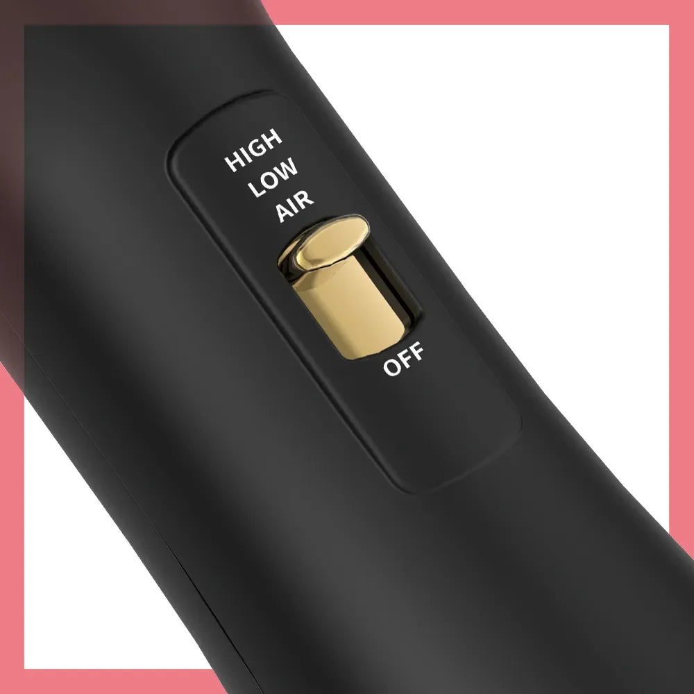 Close-up of a black hair blow dryer brush with a gold switch labeled high, low, air, and off settings.
