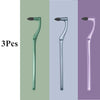 Three manual tooth stain removers with interdental brushes shown in shades of green, blue-gray, and purple.