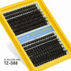 A yellow plastic box containing black cluster eyelash extensions for DIY use.