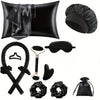 A set of black heatless curling kit accessories including a pillow, a heatless curling iron, and silk accessories.