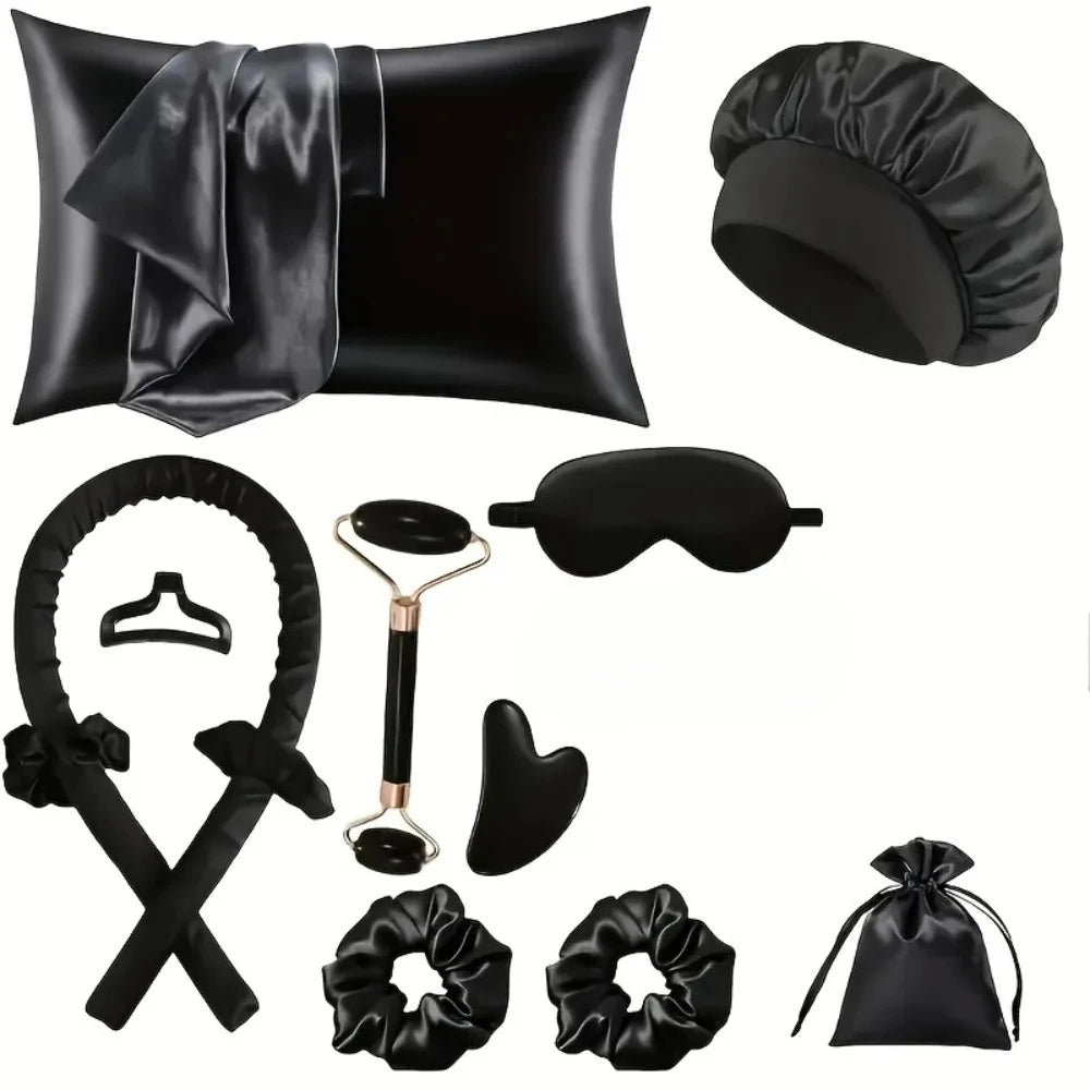 A set of black heatless curling kit accessories including a pillow, a heatless curling iron, and silk accessories.