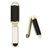 A folding pocket hair comb with a mirror and scalp massage cushion shown in light beige and black.