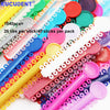 A collection of colorful orthodontic elastic ligature ties and rods for dental braces.