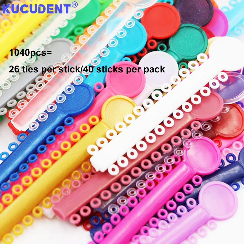 A collection of colorful orthodontic elastic ligature ties and rods for dental braces.