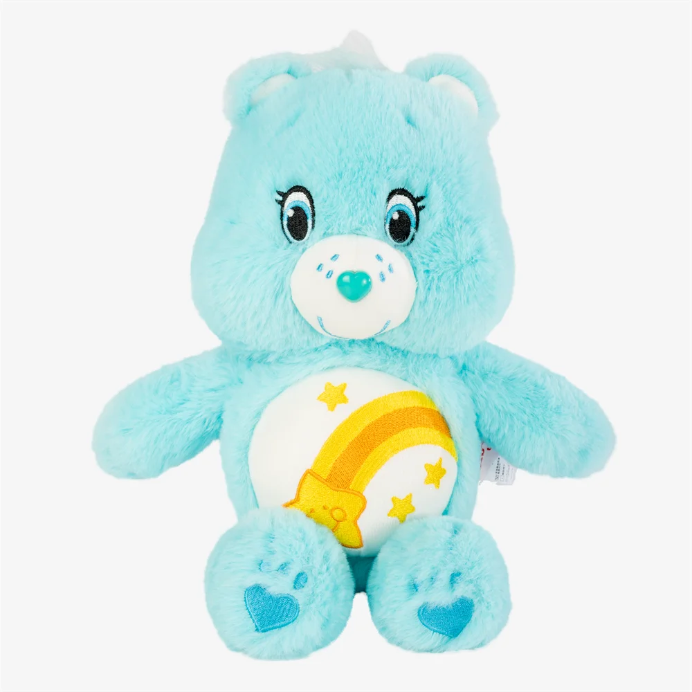 A light blue classic care bears plush stuffed animal doll with a yellow rainbow design on its chest