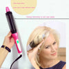 A hand holds a pink hair styling tool with various attachments, demonstrating different hairstyles on a woman's blonde hair.
