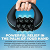 A hand is holding a black electric percussive massager designed for deep muscle relief.