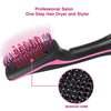 A black hair dryer and styler featuring a pink silicone brush for professional salon use.