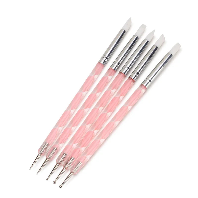 A set of five pink silicone dotting pens with stainless steel tips arranged diagonally.