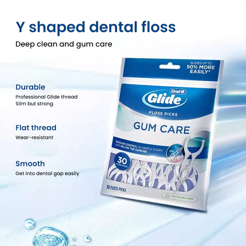 A package of Oral-B Glide floss picks for deep cleaning and gum care shown next to a dental gauze.