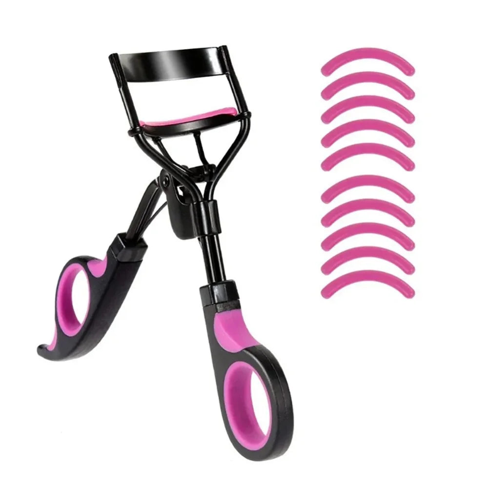 A black professional eyelash curler with replacement pads in bright pink.