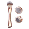 A double-ended makeup brush set featuring soft pink and gray synthetic bristles.
