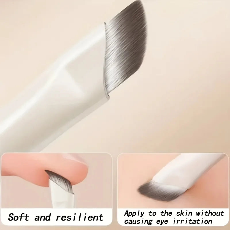 A close-up view of a professional makeup brush showing its soft bristles and handle, emphasizing its resilience for eye appli