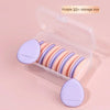 Boîte de rangement violette de 10+ contenant dix éponges de fond de teint miniatures pour un maquillage précis