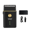 A black professional cordless electric hair trimmer kit with a charging base and detachable trimmer head.