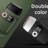 A double color precision electric shaver shown in green and black, highlighting the dual color option.