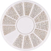 A circular plate of gold mixed stainless steel beads used for nail art decorations, arranged in radial sections.
