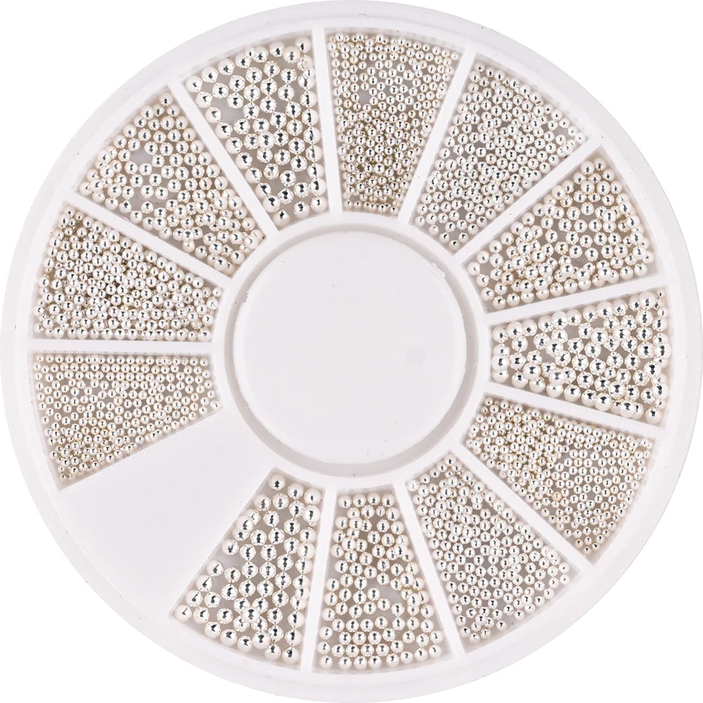 A circular plate of gold mixed stainless steel beads used for nail art decorations, arranged in radial sections.