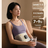 A woman is using an EMS waist pulse massager while sitting on a sofa, demonstrating different intensity levels.
