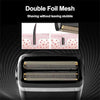 Close-up of a black electric hair clipper trimmer with double foil mesh attachments.