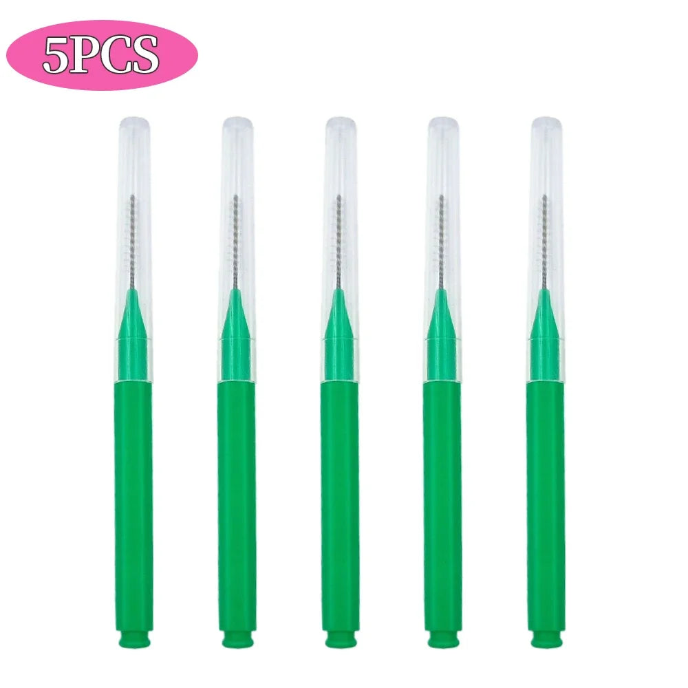 A set of five mini brow and eyelash combs in green.