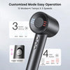 A black professional high-speed hair dryer with a control dial and power switch shown in detail.
