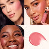 Close-up of a woman applying pink liquid blush on her cheek and lips.