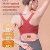 A woman is using a pink multi-speed temperature adjustable heated abdominal massage belt on her torso.