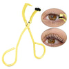 A gold stainless steel wide-angle eyelash curler tool with a black rubber pad for curling eyelashes.
