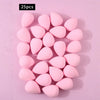 A set of 25 pink, oval-shaped XL soft makeup sponges arranged on a light pink background.