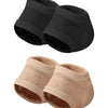 A set of four silicone heel protectors in navy blue, black, beige, and white.