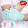 Light blue silicone back scrubber brush being used on skin for cleansing and exfoliating massage.
