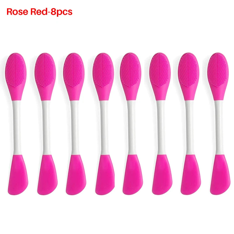 A set of eight silicone facial brushes in pink and red for exfoliation