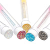 Un set de brochas reutilizables para pestañas con varios colores de purpurina y pigmento en tubos.