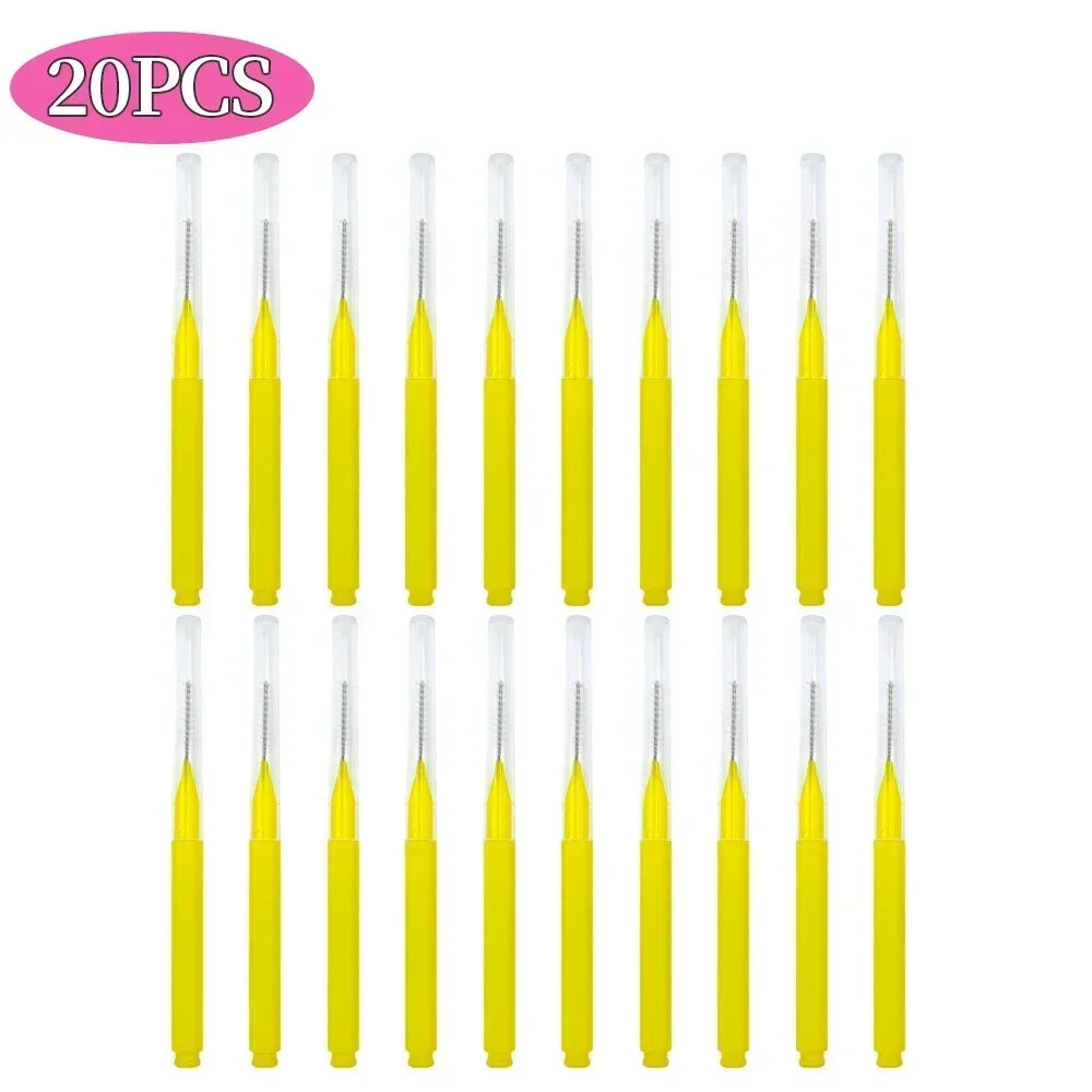 A set of 20 mini brow and eyelash combs in yellow.