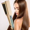 A woman is using a professional titanium hair straightener with a touch screen to straighten her long brown hair.