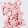 A clear plastic bag filled with pink latex-free finger puffs for makeup application.